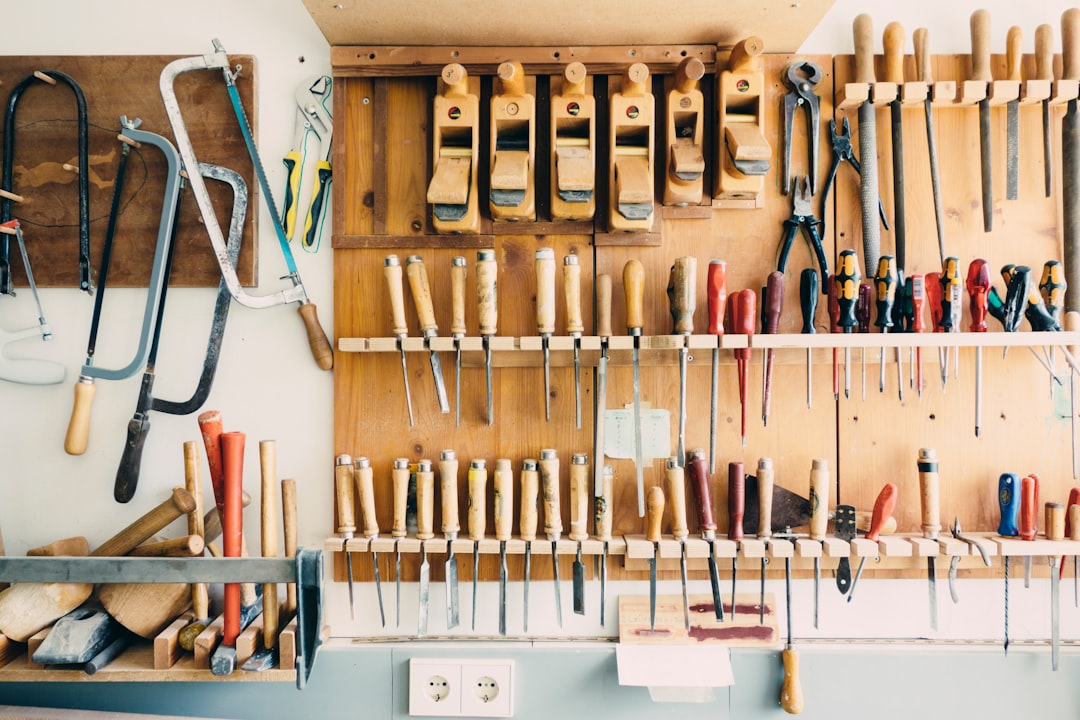 Vintage hand tools mounted on a pegboard — a metaphor for the right tools for the job
